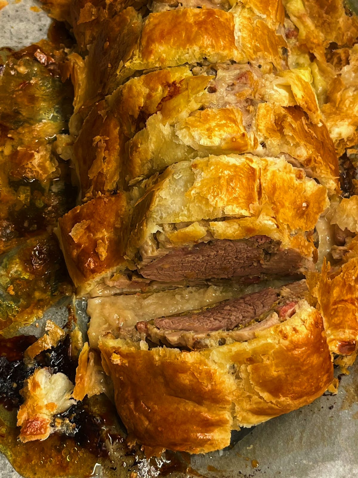 Sliced beef Wellington with golden pastry